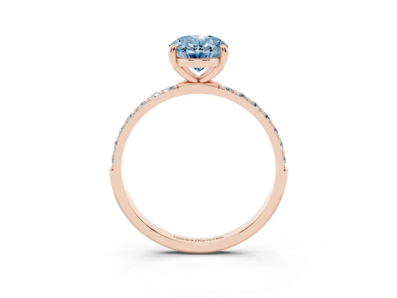 Fancy Blue Oval Cut Diamond Solitaire Ring Set in Rose gold with Round Pavé Band and Prong Setting
