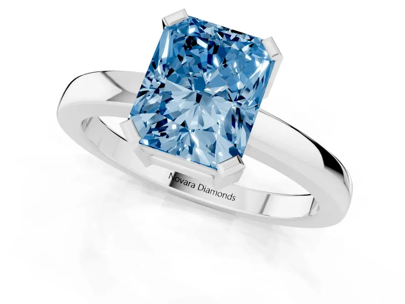 Fancy Blue Radiant Cut Diamond Solitaire Ring Set in Platinum with Prong Head and Smooth Polished Band
