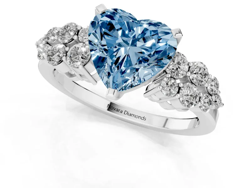 Fancy Blue Heart Cut Diamond Cluster Engagement Ring Set in Platinum with Pavé Band and Prong Setting