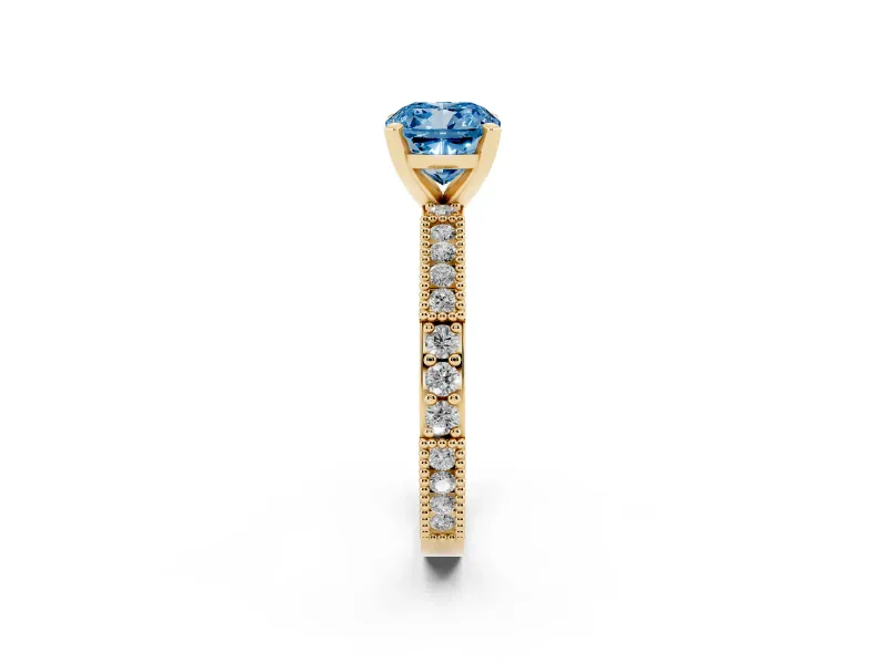 Fancy Blue Cushion Cut Diamond Solitaire Ring Set in Yellow gold with Slim Pavé Band and Prong Setting