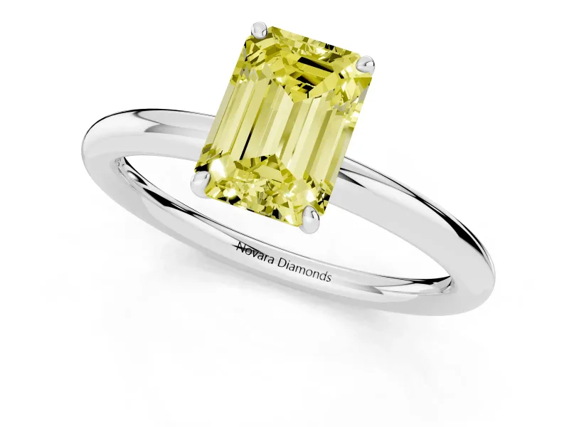 Fancy Yellow Emerald Cut Diamond Solitaire Ring Set in Platinum with Prong Setting on a Polished Plain Band