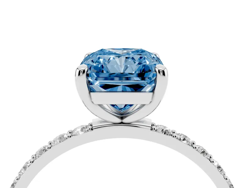 Fancy Blue Radiant Cut Diamond Solitaire Ring Set in Platinum with Round Pavé Band and Prong Setting