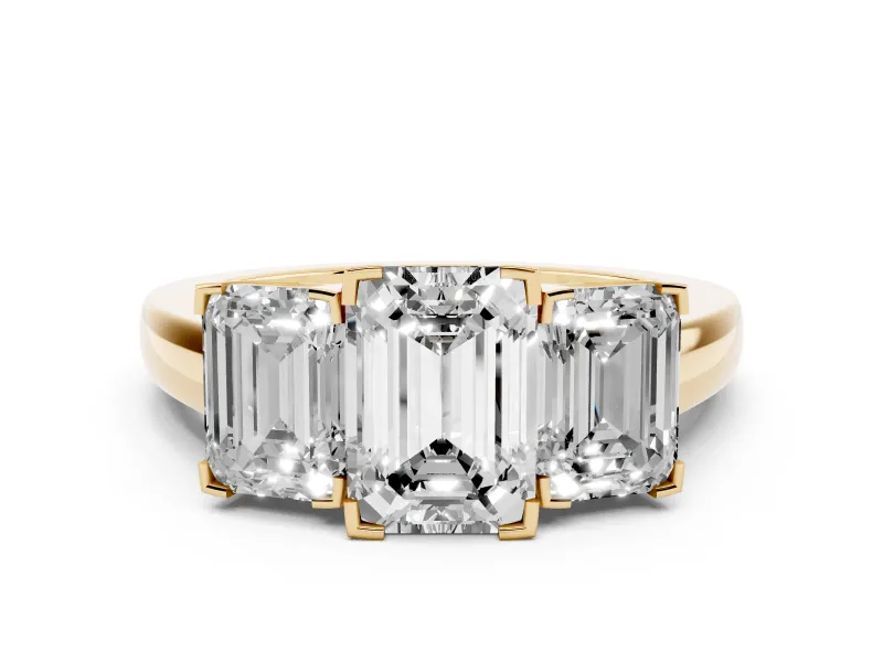 Emerald Cut Diamond Three-Stone Ring Set in Yellow gold with Channel-Set Band and Prong Settings