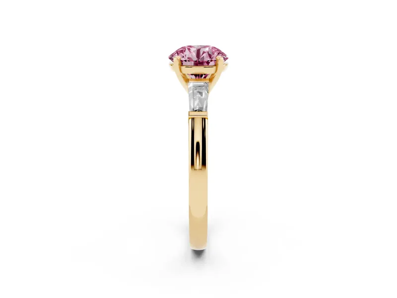 Fancy Pink Round Cut Diamond Solitaire Ring Set in Yellow gold with Tapered Baguette Side Stones and Prong Setting
