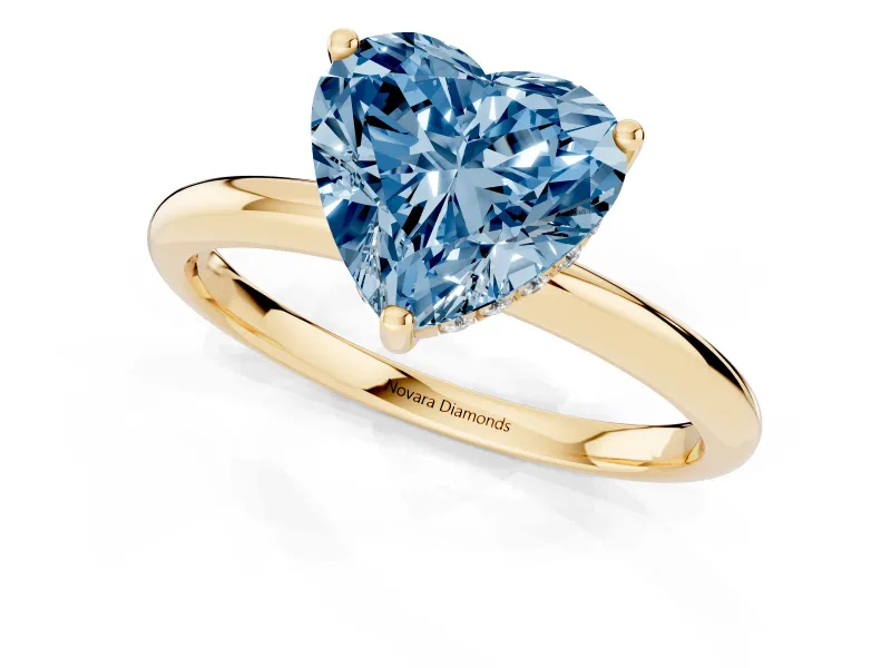 Fancy Blue Heart Cut Diamond Solitaire Engagement Ring Set in Yellow gold with Prong Setting and Polished Band