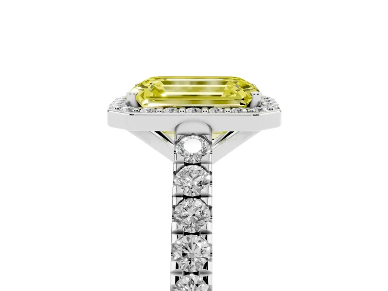 Fancy Yellow Emerald Cut Diamond Halo Engagement Ring Set in White gold with Pavé Band and Prong Setting