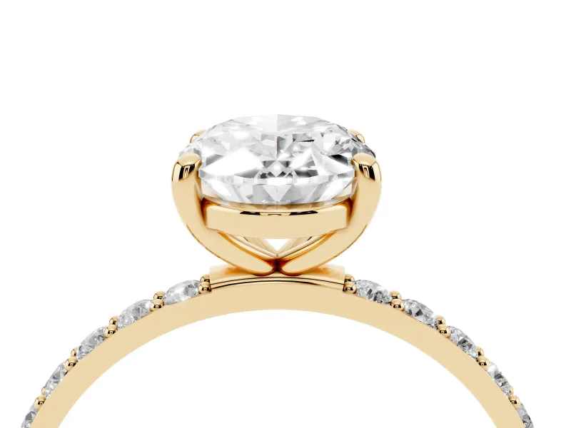 Oval Cut Diamond Solitaire Ring Set in Yellow gold with Round Pavé Band and Prong Setting