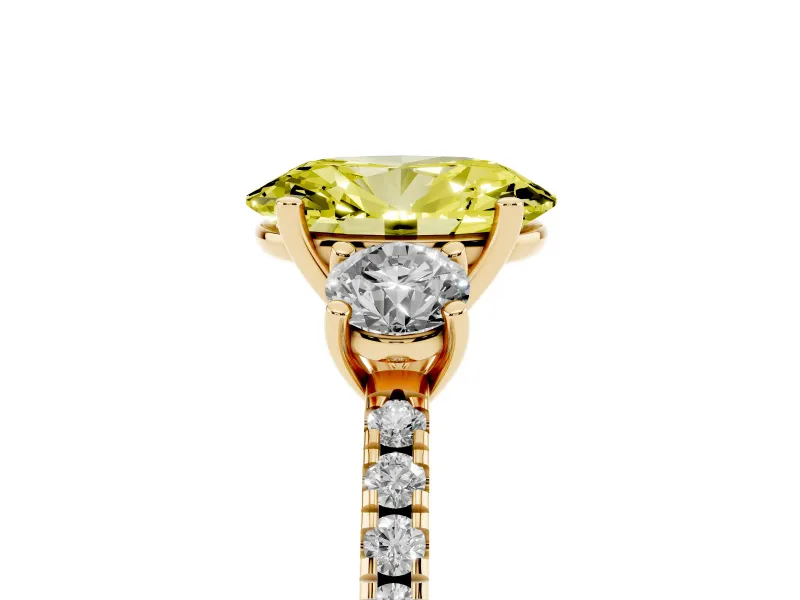 Fancy Yellow Oval Cut Diamond Three-Stone Ring Set in Yellow gold with Pavé Band and Graduated Sides