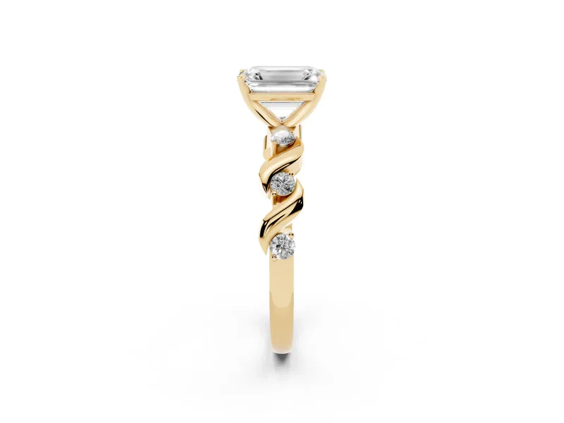 Emerald Cut Diamond Solitaire Ring Set in Yellow gold with Ribbon Twist Band, Round Accents and Prong Setting
