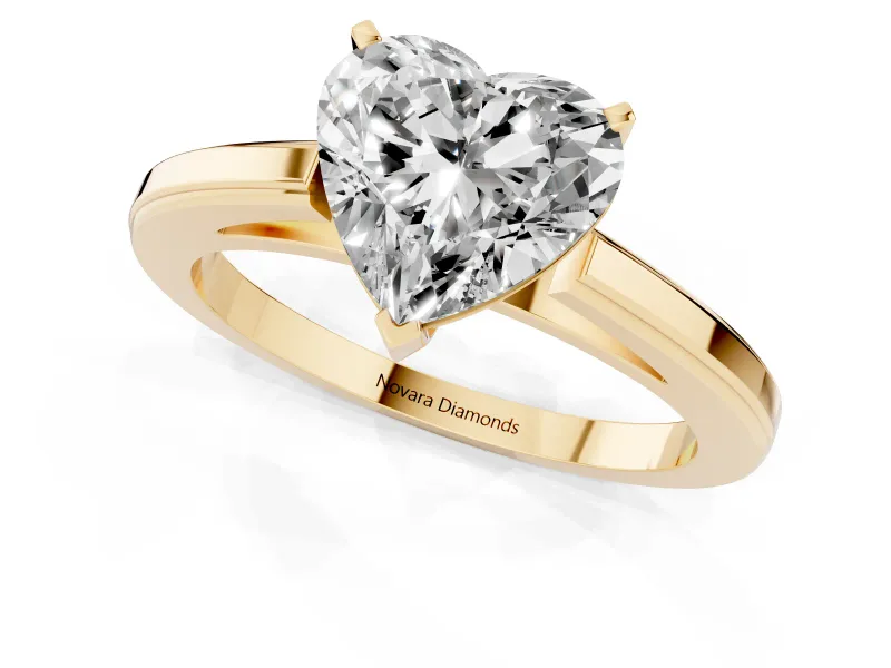 Heart Cut Diamond Solitaire Ring Set in Yellow gold with Prong Setting and Classic Band