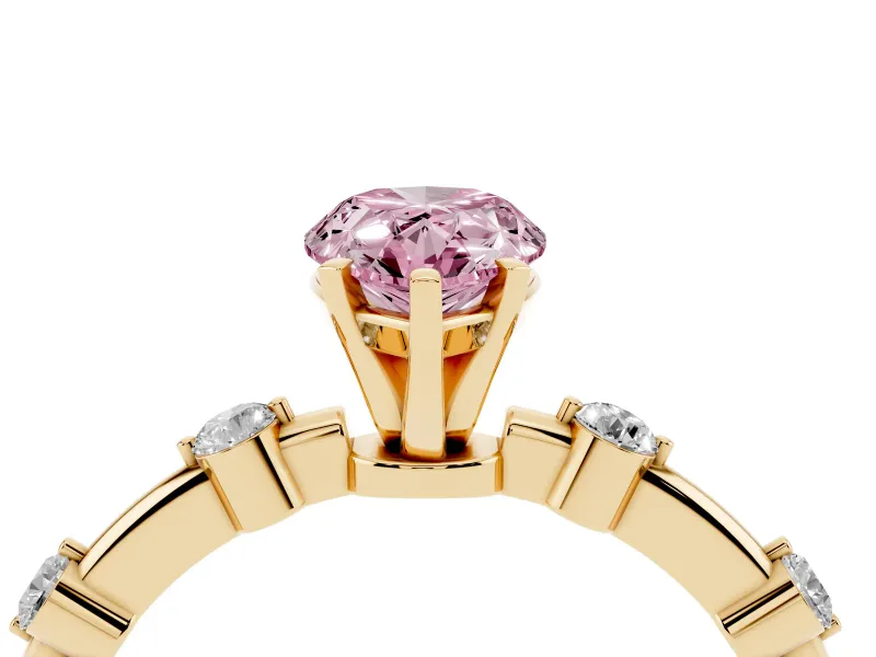 Fancy Pink Pear Cut Diamond Solitaire Ring Set in Yellow gold with Bezel Set Side Stones and Prong Setting