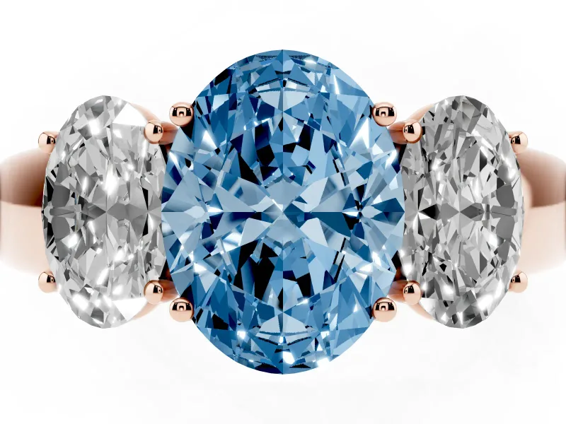 Fancy Blue Three-Stone Oval Cut Diamond Ring Set in Rose gold with Matching Prong Settings and Plain Band