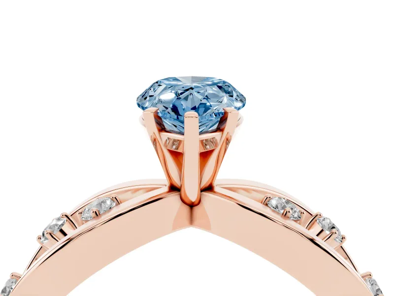 Fancy Blue Pear Cut Diamond Solitaire Ring Set in Rose gold with Side Stones on Criss-Cross Band and Prong Setting