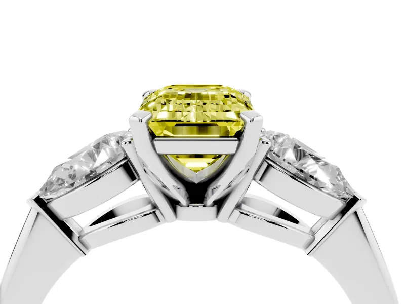 Fancy Yellow Three-Stone Emerald Cut Diamond Ring Set in White gold with Pear Side Stones and Prong Setting