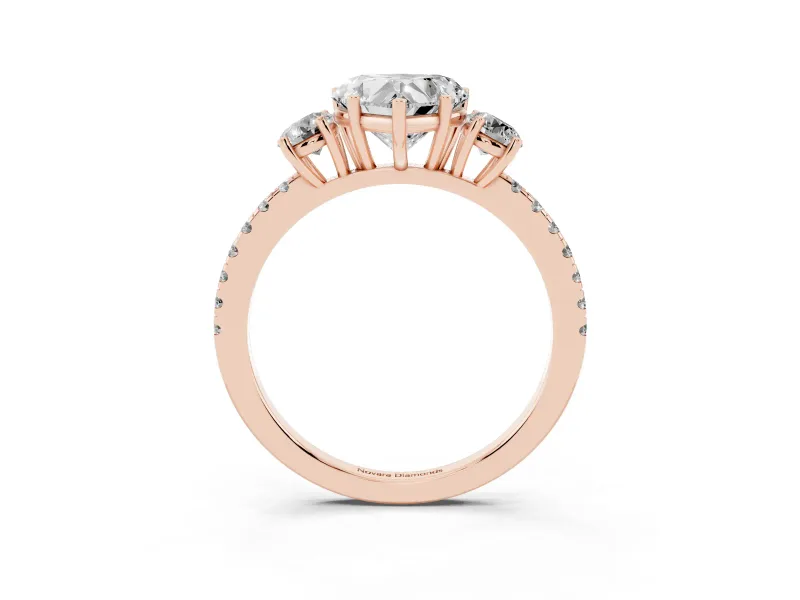 Heart Cut Diamond Three-Stone Ring Set in Rose gold with Pavé Band and Graduated Sides