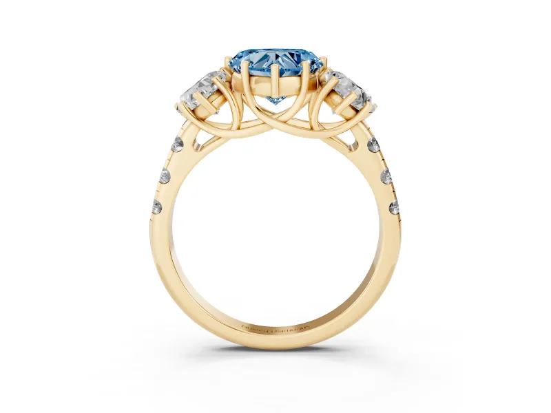 Fancy Blue Heart Cut Diamond Three-Stone Ring Set in Yellow gold with Pavé Band
