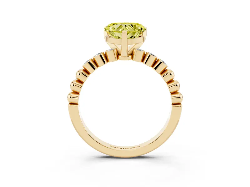 Fancy Yellow Heart Cut Diamond Solitaire Engagement Ring Set in Yellow gold with Bezel Accents on Beaded Band