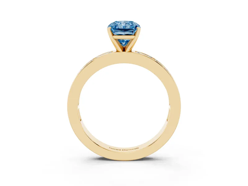 Fancy Blue Radiant Cut Diamond Solitaire Ring Set in Yellow gold with Channel-Set Baguette Band and Prong Setting