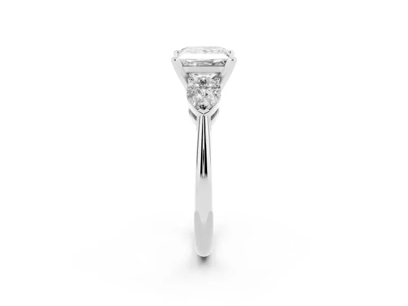 Three-Stone Princess Cut Diamond Ring Set in Platinum with Pear Side Stones and Prong Setting