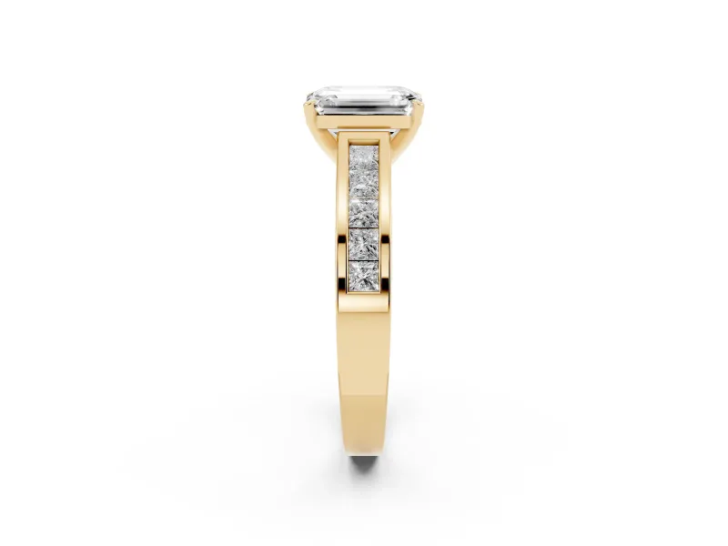 Emerald Cut Diamond Solitaire Ring Set in Yellow gold with Channel-Set Band and Prong Setting