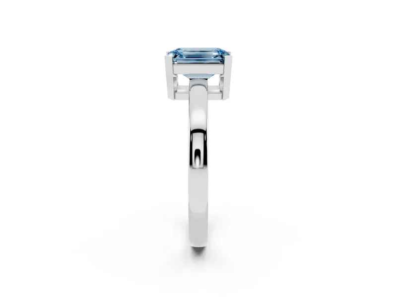 Fancy Blue Emerald Cut Diamond Solitaire Ring Set in Platinum with Prong Head and Smooth Polished Band