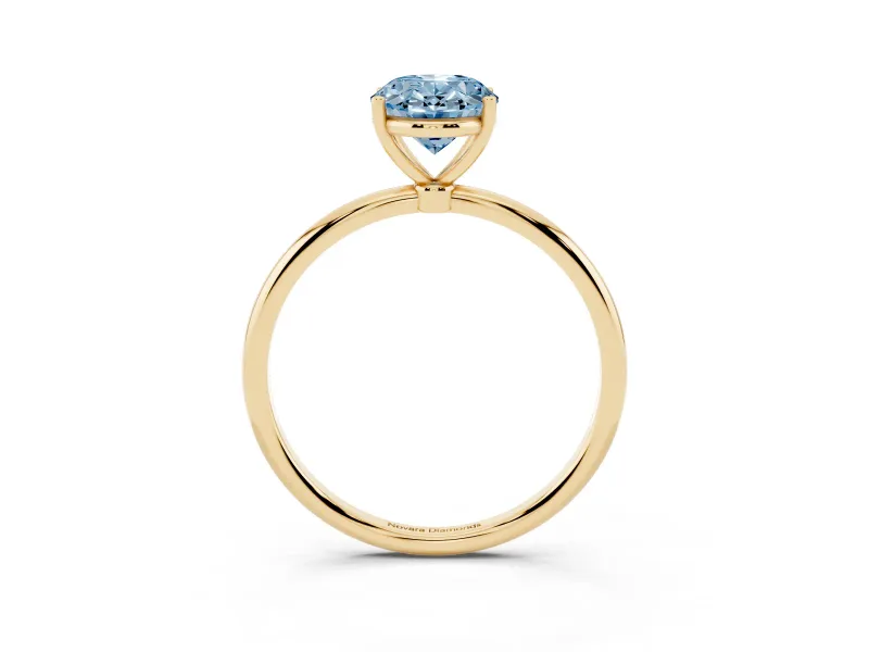 Fancy Blue Oval Cut Diamond Solitaire Engagement Ring Set in Yellow gold with Thin Band and Prong Setting