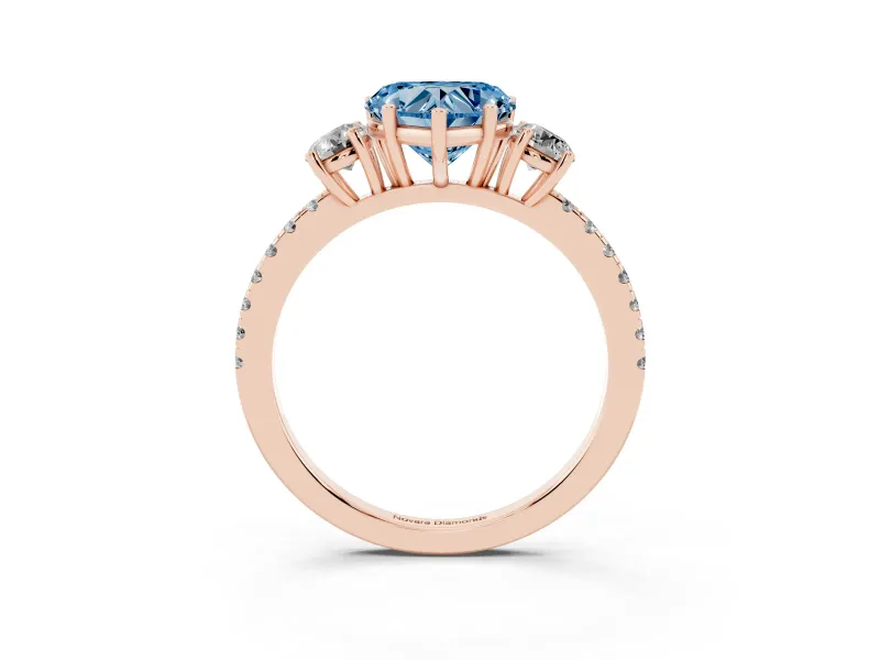 Fancy Blue Heart Cut Diamond Three-Stone Ring Set in Rose gold with Pavé Band and Graduated Sides