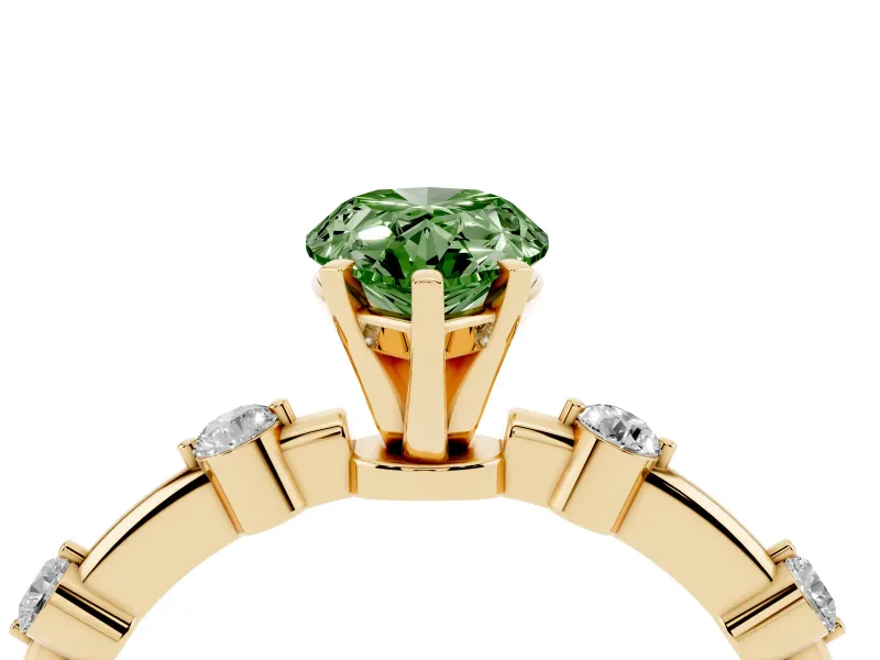 Fancy Green Pear Cut Diamond Solitaire Ring Set in Yellow gold with Bezel Set Side Stones and Prong Setting