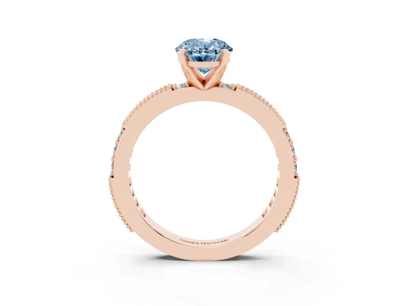 Fancy Blue Oval Cut Diamond Solitaire Ring Set in Rose gold with Slim Pavé Band and Prong Setting