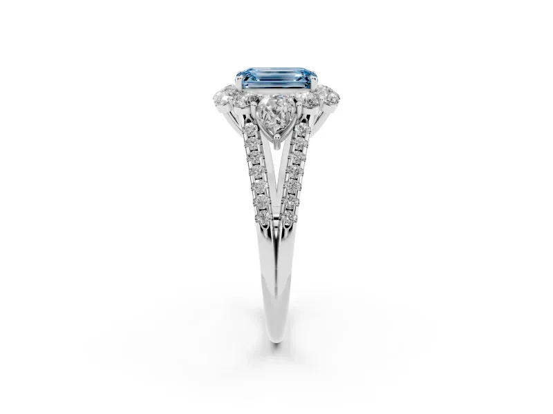 Fancy Blue Emerald Cut Diamond Halo Split Shank Engagement Ring Set in White gold with Prong-Held Center Stone