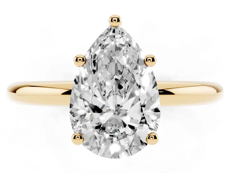 Pear Cut Diamond Solitaire Engagement Ring Set in Yellow gold with Prong Setting and Polished Band