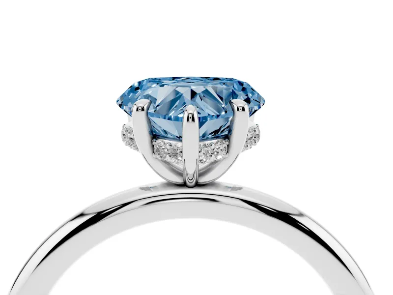 Fancy Blue Heart Cut Diamond Solitaire Ring Set in Silver with Thin Band and Prong Setting