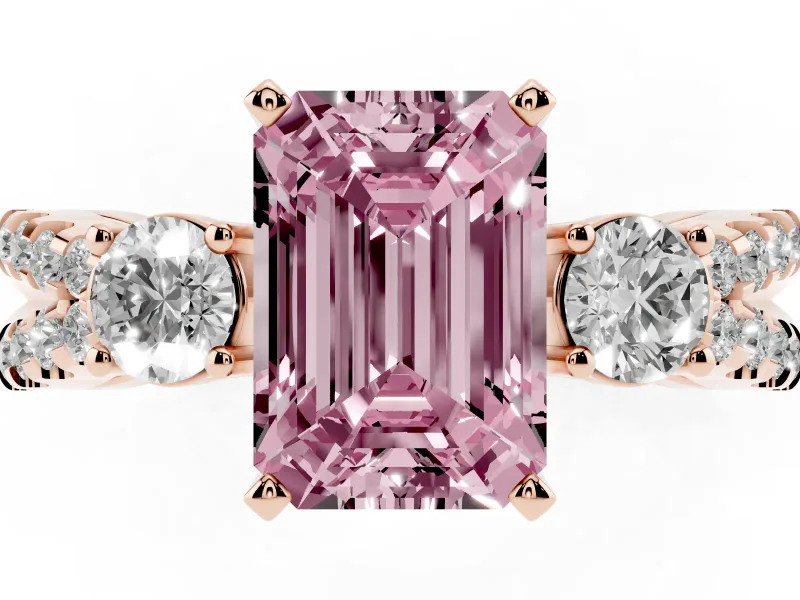 Fancy Pink Emerald Cut Diamond Three-Stone Ring Set in Rose gold with Pavé Split Shank and Prong Setting