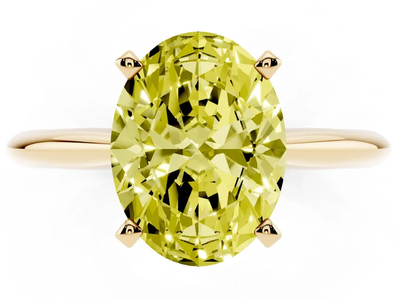 Fancy Yellow Oval Cut Diamond Solitaire Ring Set in Yellow gold with Prong Setting on a Plain Round Band