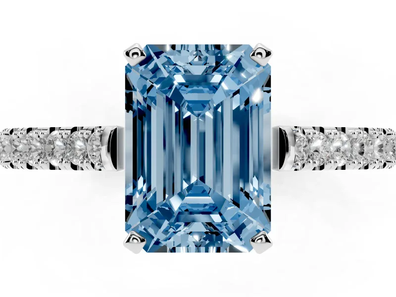 Fancy Blue Emerald Cut Diamond Solitaire Engagement Ring Set in Silver with Delicate Pavé Band and Prong Setting