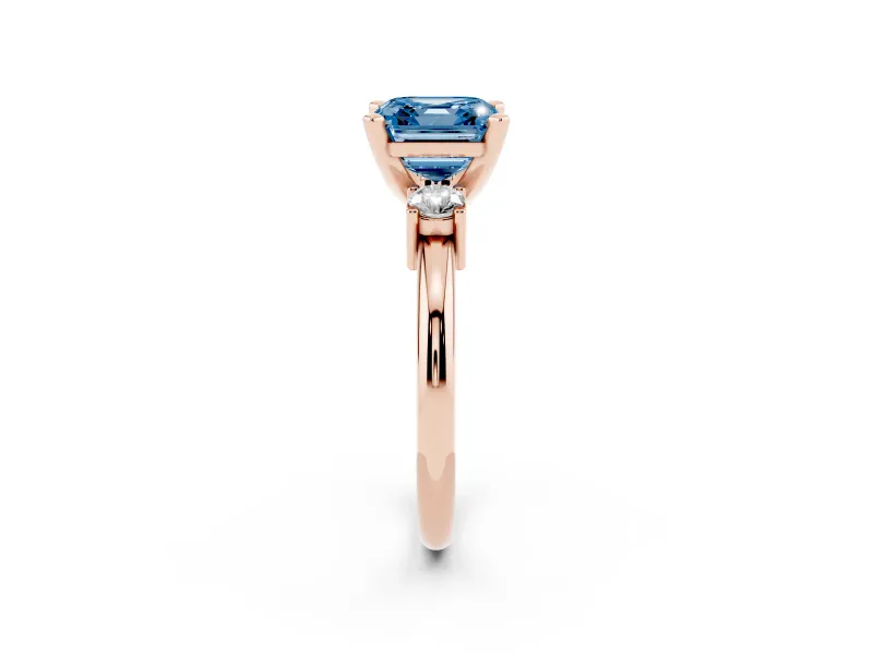 Fancy Blue Three-Stone Asscher Cut Diamond Ring Set in Rose gold with Prong Setting and Plain Band
