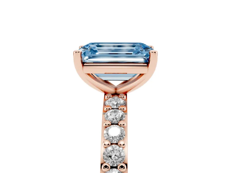 Fancy Blue Emerald Cut Diamond Solitaire Set in Rose gold with Round Pavé Band and Prong Setting