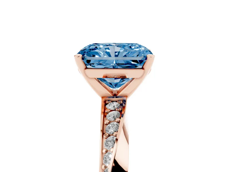 Fancy Blue Radiant Cut Diamond Engagement Ring Set in Rose gold with Side Stone Accents and Prong Setting