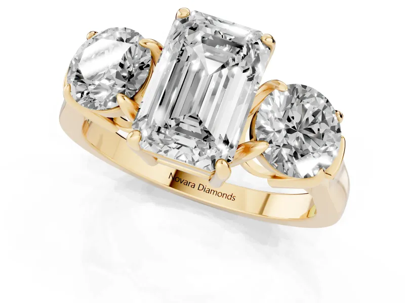 Emerald Cut Diamond Three-Stone Ring Set in Yellow gold with Round Accent Stones and Plain Band