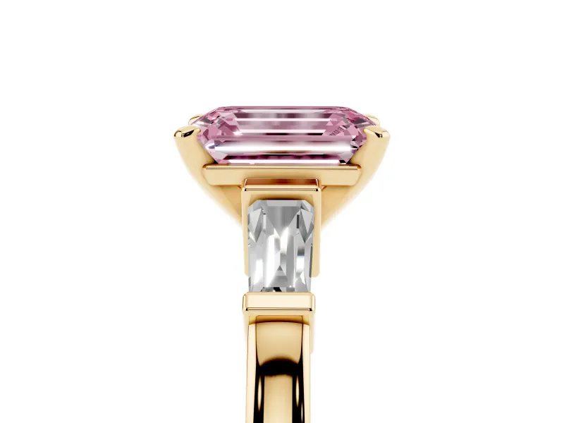 Fancy Pink Emerald Cut Diamond Solitaire Ring Set in Yellow gold with Tapered Baguette Accents and Prong Setting