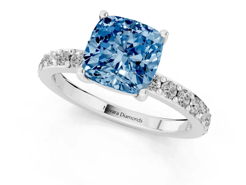Fancy Blue Cushion Cut Diamond Solitaire Set in Platinum with Round Pavé Band and Prong Setting