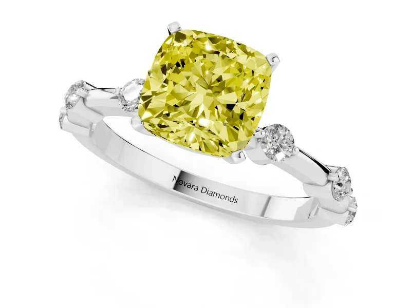Fancy Yellow Cushion Cut Diamond Solitaire Ring Set in White gold with Bezel Set Side Stones and Prong Setting