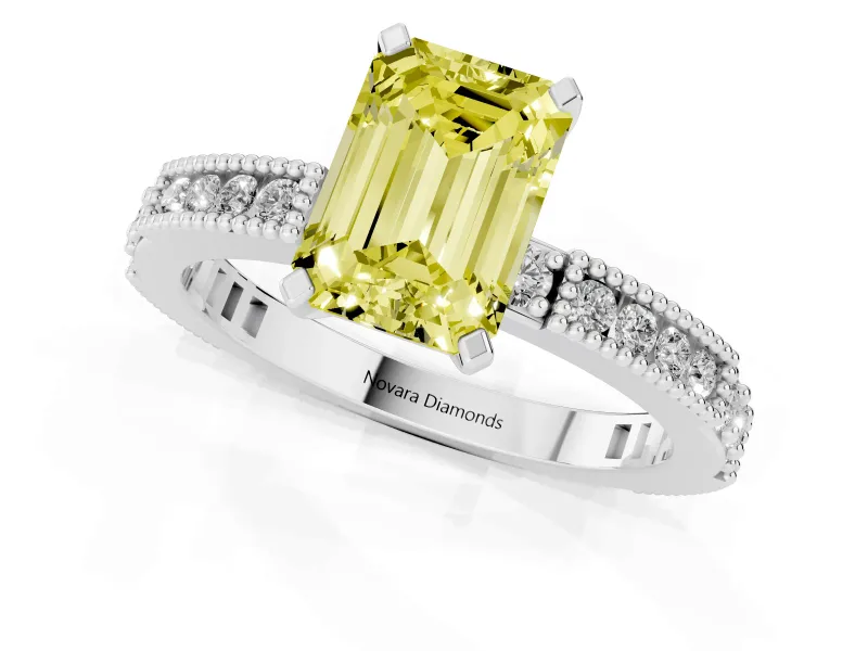 Fancy Yellow Emerald Cut Diamond Solitaire Ring Set in White gold with Slim Pavé Band and Prong Setting