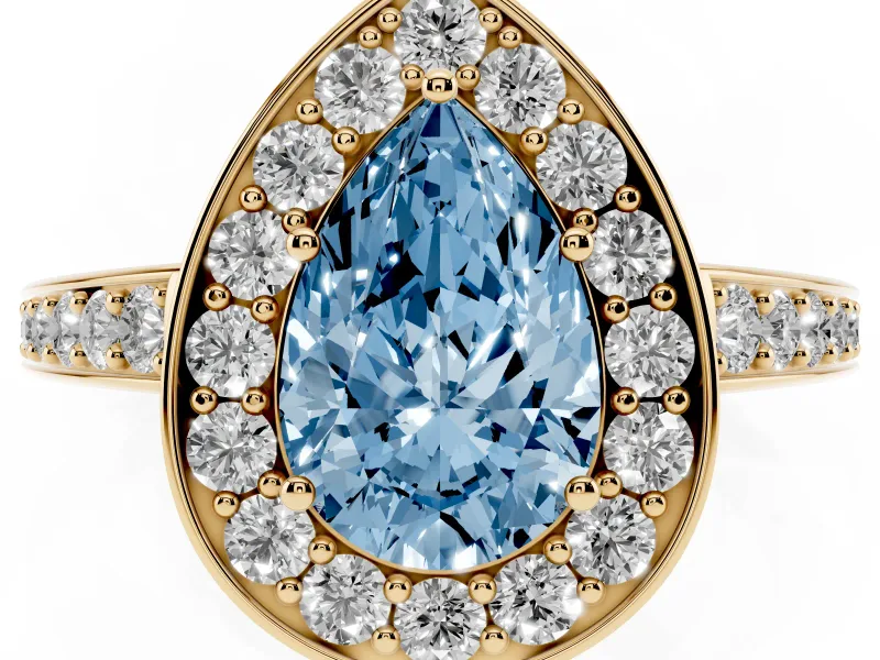 Fancy Blue Pear Cut Diamond Halo Pavé Engagement Ring Set in Yellow gold with Bezel Setting
