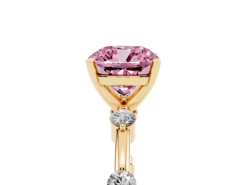 Fancy Pink Cushion Cut Diamond Solitaire Ring Set in Yellow gold with Bezel Set Side Stones and Prong Setting