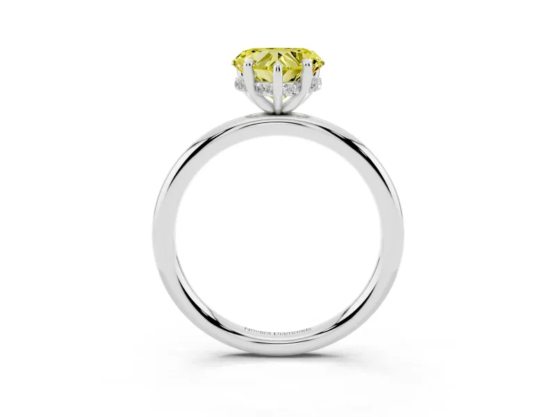 Fancy Yellow Heart Cut Diamond Solitaire Ring Set in White gold with Thin Band and Prong Setting