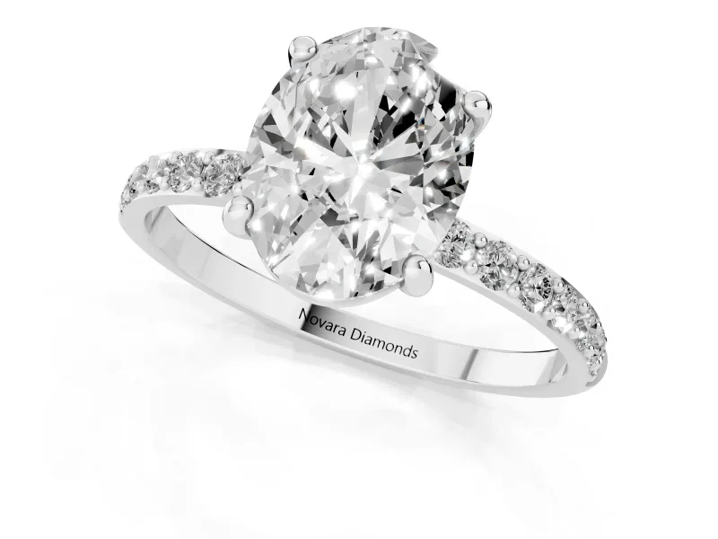 Oval Cut Diamond Solitaire Ring Set in Silver with Round Pavé Band and Prong Setting