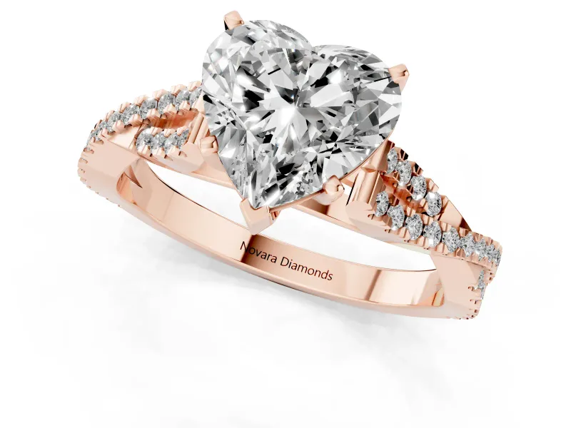 Heart Cut Diamond Solitaire Engagement Ring Set in Rose gold with Twisted Pavé Band and Prong Setting