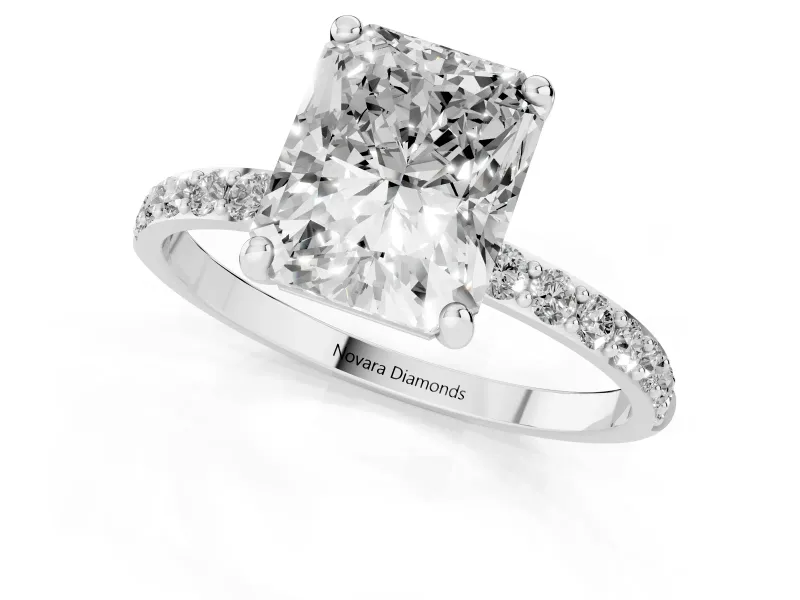 Radiant Cut Diamond Solitaire Ring Set in Platinum with Round Pavé Band and Prong Setting