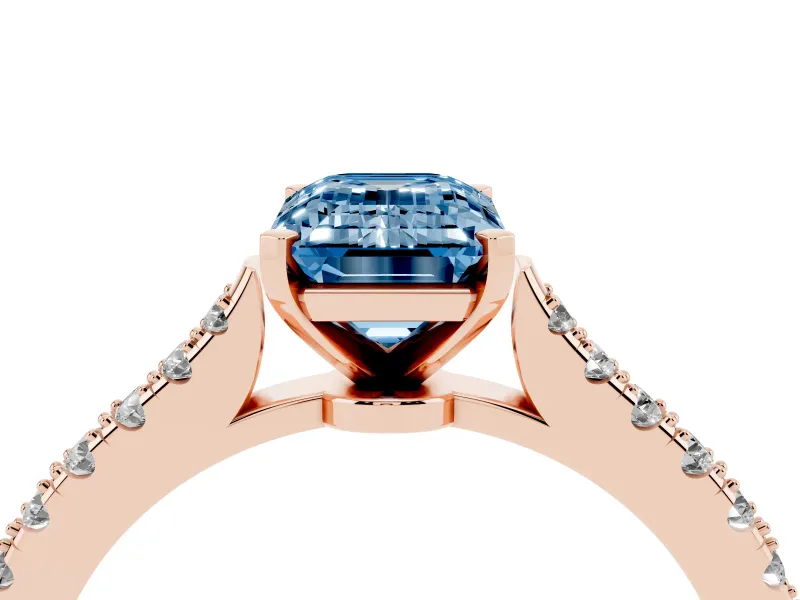 Fancy Blue Emerald Cut Diamond Solitaire Engagement Ring Set in Rose gold with Delicate Pavé Band and Prong Setting